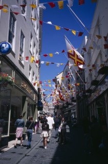 UNITED KINGDOM, Channel Islands, Guernsey, "St Peter Port. View up narrow cobbled high street,