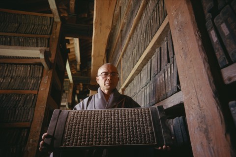 SOUTH KOREA, South Kyongsan, Mount Kaya, "Temple of Haeinsa.  Monk with one of the Tripitaka