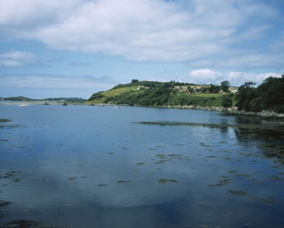 IRELAND, County Kerry, Ring of Kerry, Beara Peninsula. View over water towards boats and houses on