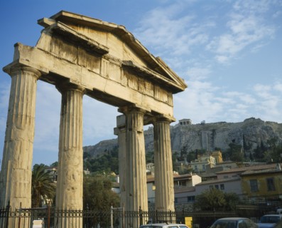 GREECE, Central, Athens, Plaka - Ancient Agora and Acropolis on top. Old ruined columns behind a