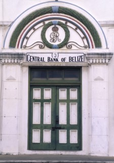 BELIZE, Belize City, The front door of the central bank with a crest in the archway above and