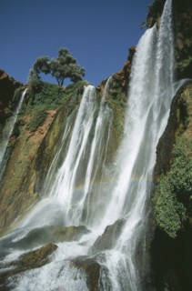 MOROCCO, Middle Atlas, Cascades d’Ouzoud, Waterfalls of the Olives.  Multiple falls cascading over