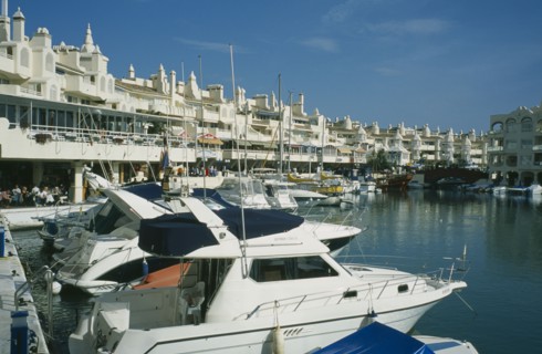 SPAIN, Andalucia, Benalmadena, Award winning marina project in Europe. Boats docked with buildings