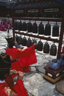 SOUTH KOREA, Seoul, Confucian Rites Ceremony at Chong Shrine. Men in red robes sat on ground