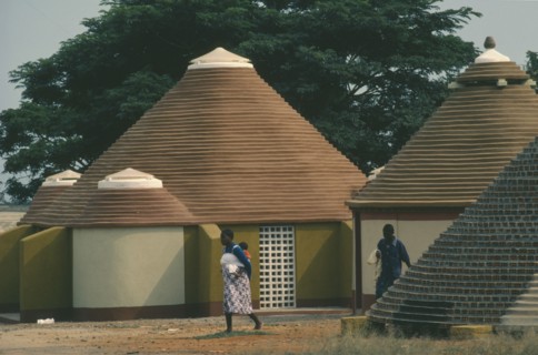 ANGOLA, Tradtional Homes, Women and child outside new village housing.