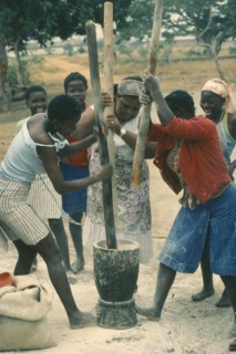 ANGOLA, Work, Village women pounding grain.