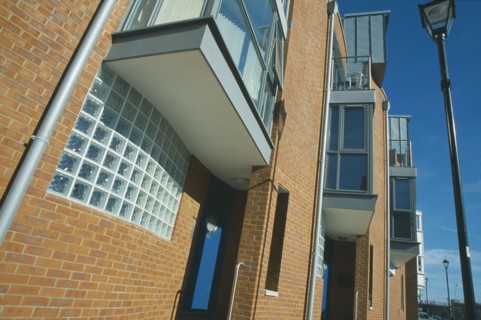 ENGLAND, Hampshire, Portsmouth, Old Portsmouth. Angled view of modern apartment building and street