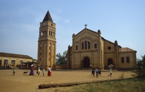 RWANDA, Religion, Missionary church and school with women and children walking across courtyard in