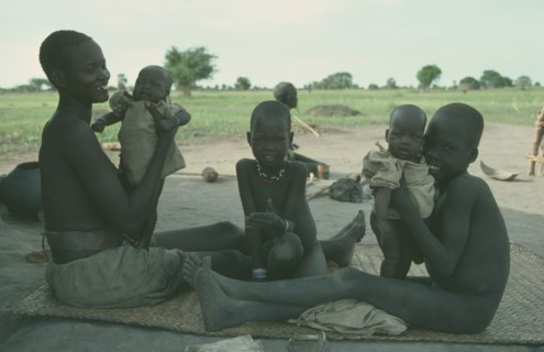 SUDAN, Children, Twins, Dinka mother with twin babies and two older children.