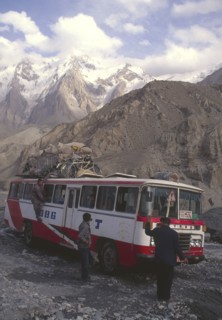CHINA, Hunza, Karakorum, Bus negotiating a flooded river on the Karakorum highway on route to China