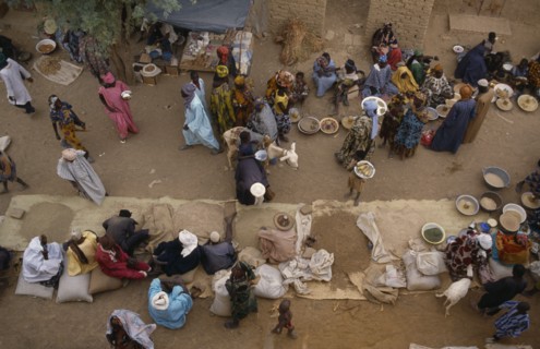 MALI, Sahel Desert, Tonka, "Looking down on traders, customers and stalls at busy rural market. "