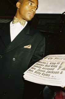ENGLAND, London, Notting Hill, A man sells copies of The Final Call newspaper during the Notting