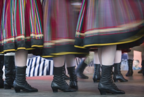 POLAND, Warsaw, "Detail of traditional dancers' costumes performing in the Old Town. Moving,
