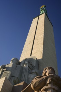 LATVIA, Riga, "Detail of the Freedom Monument. Milda, the figure on top of the pediment holds 3