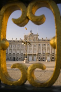 SPAIN, Madrid, The Palacio Real. The Royal Palace seen through a section of the main gates.