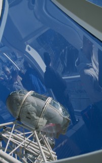 ENGLAND, London, British Airways London Eye. View of pods with people inside the capsule reflected