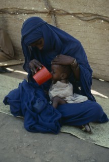 SUDAN, Red Sea Hills Province, Sinkat, Woman with malnourished child at Red Cross feeding centre.