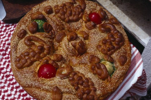 GREECE, Saronic Islands, Spetses, Easter bread decorated with painted hard boiled eggs and sesame