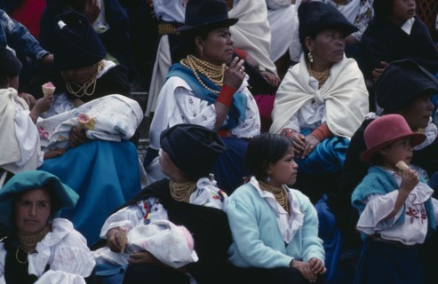 ECUADOR, Imbabura, Cotocachi, Spectators sitting on church steps to wait for Easter Sunday