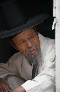 SOUTH KOREA, Seoul, Portrait of elderly Confucian Priest in traditional white robe and kat