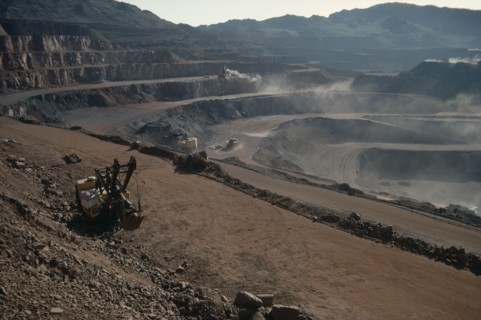MAURITANIA, Zouerate, Iron mine.  Machinery working on terraces.