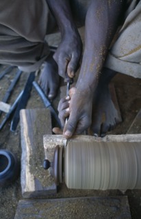 MALAWI, Zalewa, Kadzuwa Crafts.  Cropped view of craftsman using wood turner to produced fair trade