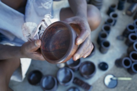 MALAWI, Zalewa, Kadzuwa Crafts.  Cropped view of craftsman producing fair trade carved items for