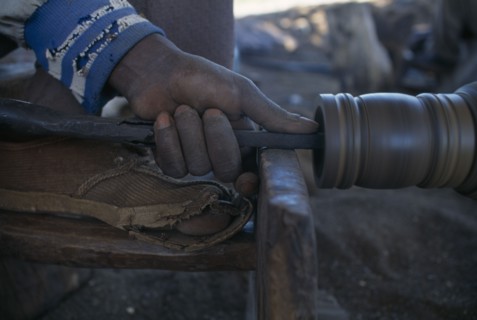 MALAWI, Zalewa, Kadzuwa Crafts.  Cropped view of craftsman using wood turner to produce fair trade