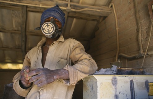 MALAWI, Dedza, Dedza Potteries producing Fair Trade goods for export.  Craftsman wearing protective