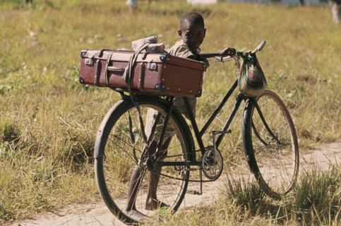 ZAMBIA, Children, Young boy with bicycle.