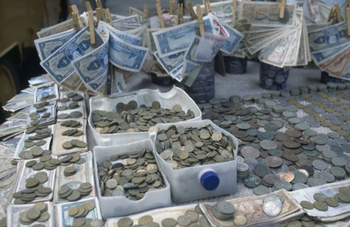 BRAZIL, Market, Stall with many different types of Brazilian coins and notes which have changed