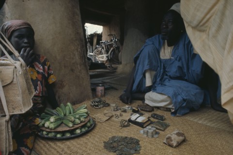 NIGERIA, Markets, Financial, Money changer with beads and jewellery also used to trade.
