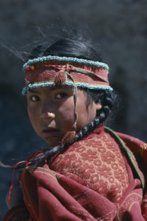BOLIVIA, Tribal People, Portrait of young girl with hair in plaits and wearing woven head band