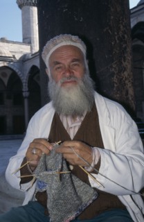 TURKEY, Istanbul, Hat vendor outside the Blue Mosque