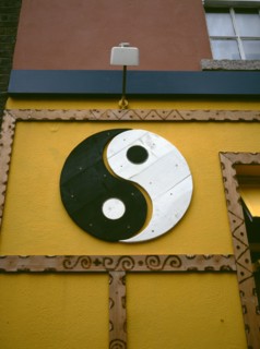 IRELAND, Dublin, "Yin and Yang symbol painted onto a wall. Yin Yang originates in ancient Chinese