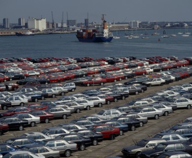 INDUSTRY, Cars, Southampton Docks. Rows of imported cars with container ships and boats on the