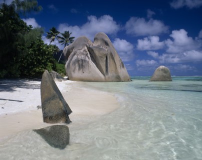 SEYCHELLES, La Digue, Source De Argent, Large rock formations on sandy beach with clear shallow