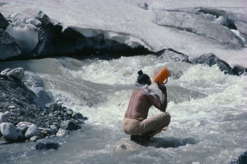 INDIA, Uttar Pradesh, Garwhal Region, "Sadhu pilgrim bathing at Gaumukh or the cow’s mouth, sacred