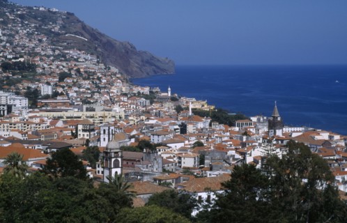PORTUGAL, Madeira, Funchal, Elevated view over the city centre from the Fortaleza do Pico or Pico