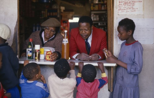 SOUTH AFRICA, Gauteng, East Rand, "Children at spaza shop.  Meaning camouflage, spaza was the name