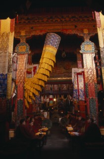 CHINA, Tibet, Monks chanting in the main chapel of Gonggar Chode Monastery near Lhasa Airport.