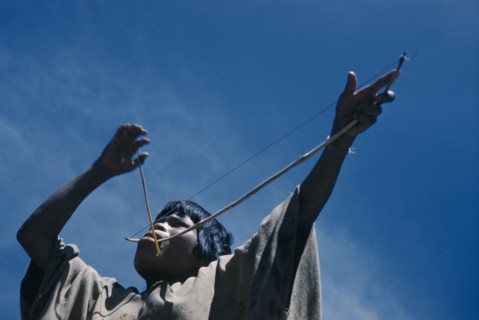 COLOMBIA, Sierra de Perija, Yuko - Motilon , Portrait of woman playing musical bow.  The