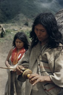 COLOMBIA, Sierra Nevada de Santa Marta, Kogi Tribe, "Man rubs lime encrusted gourd with ritual