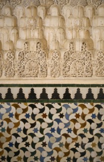 SPAIN, Andalucia, Granada, The Alhambra.  Detail of stucco and tiles