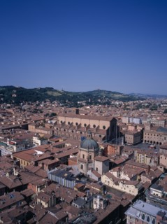 ITALY, Emilia Romagna, Bologna, View South West over the city with the brick built Church of San