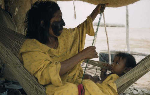 COLOMBIA, Guajira Peninsula, Guajiro / Wayuu Tribe, Mother and baby son in a “fique” / cactus fibre