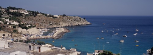 ITALY, Puglia, The village of Castro Marina on the South Adriatic Sea coast. Boats at sea and in