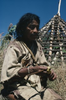 COLOMBIA, Sierra Nevada de Santa Marta, San Antonio, "Mama/Priest Valencia takes a ""coca break"" -