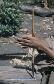 COLOMBIA, Sierra de Perija, Yuko - Motilon ., Man drills hole in base of steel arrow-head for