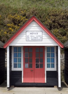 ENGLAND, Dorset, Bournemouth, Beach hut on The East Beach with a sign saying that no ball games are